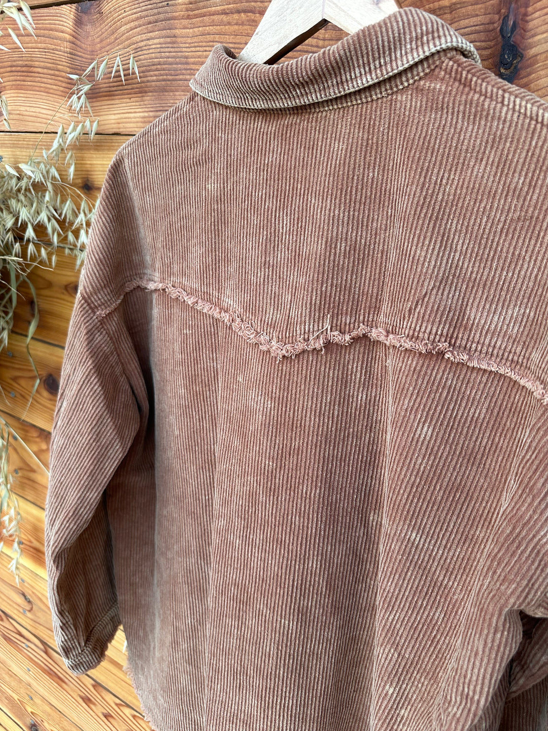 Discover the perfect layering piece with The Hester Camel Shacket. Featuring a fashionable mineral washed finish, this shacket includes a classic collar, front button closure, and functional front chest pockets. Its long sleeves with button cuffs contribute to the relaxed fit, making it a versatile addition to your wardrobe. Made from a blend of 95% polyester and 5% spandex, it comes in Small (3-5), Medium (6-8), and Large (9-11). For a better fit, we recommend sizing down if you're between sizes.