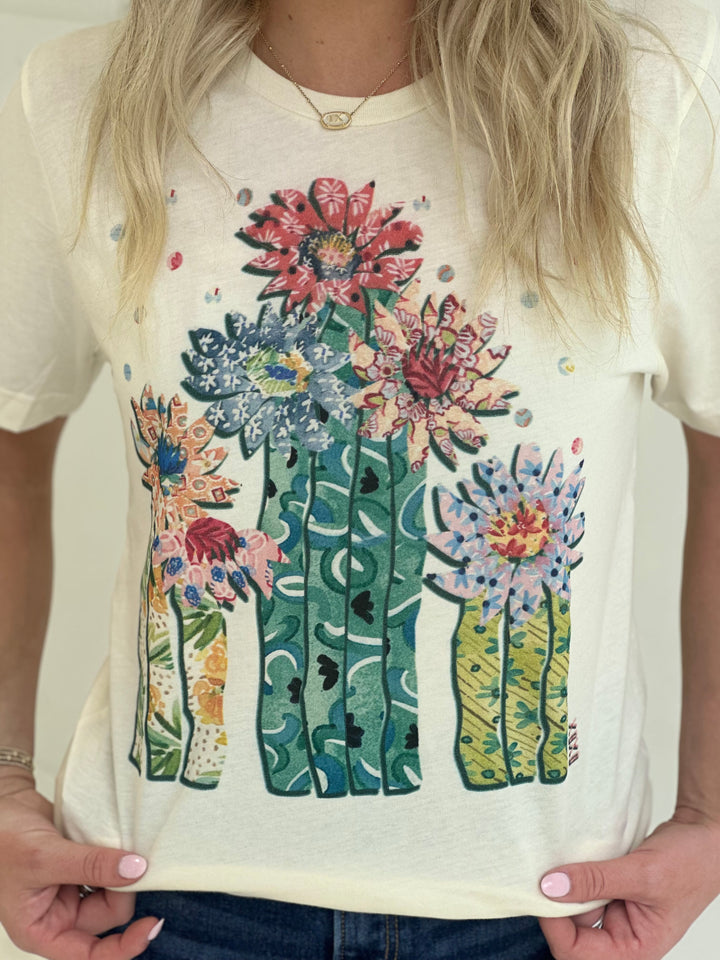 Saddle up in style with The Saguaro tee, featuring a one-of-a-kind hand-drawn western graphic by XOXOart & Co. Made from 100% cotton and designed with a relaxed unisex fit, this natural-toned t-shirt brings desert vibes and serious comfort to any outfit.