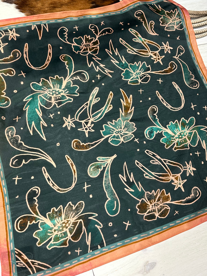 The Floral Wild Rag, crafted from 100% Mulberry silk, designed as a western wild rag. Multi-use accessory for bandanas, headbands, ponytails, or neck scarves, sized at 35" x 35".