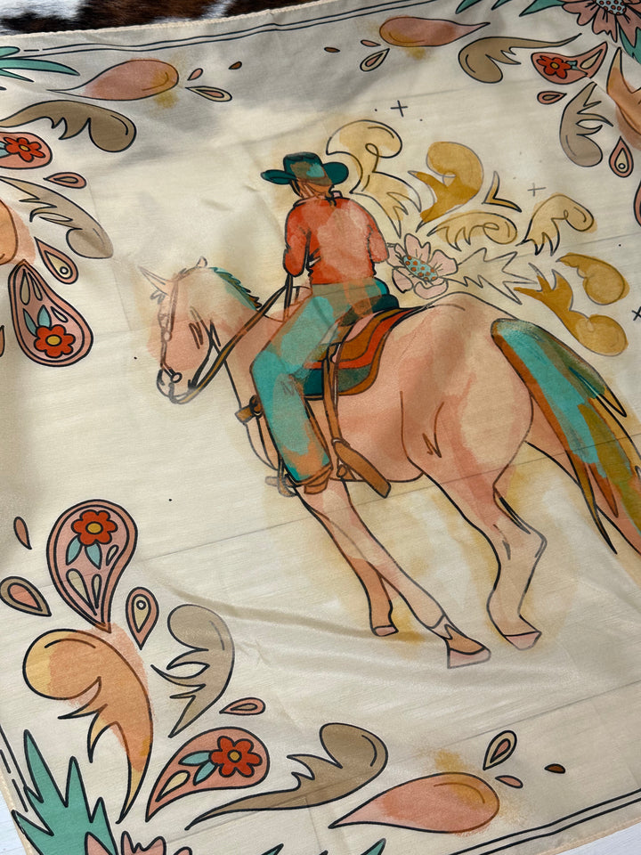 The Summer Ride Wild Rag, crafted from 100% Mulberry silk, designed as a western wild rag. Multi-use accessory for bandanas, headbands, ponytails, or neck scarves. Size 35" x 35".