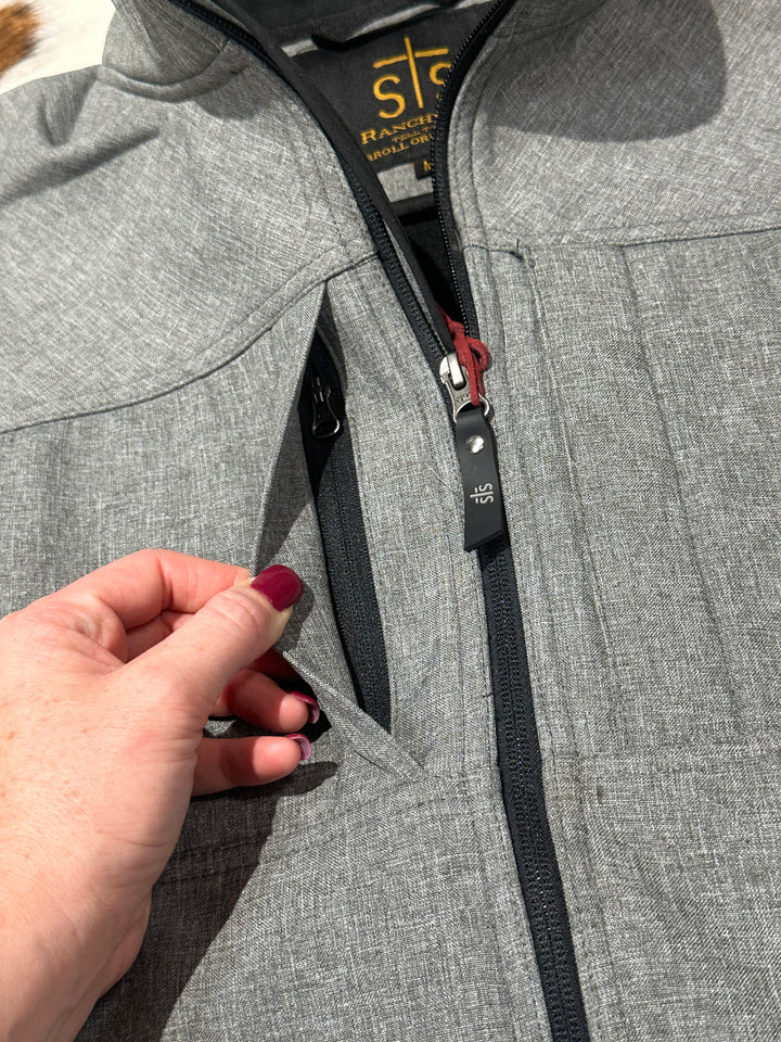 The Men's Weston jacket is designed for cold weather comfort. Featuring a fleece lining, zip front closure, and an interior waist drawstring, it ensures a snug, warm fit. Includes two hand-warming pockets and zippered chest pockets for secure storage. Made from 96% polyester and 4% spandex for durability and stretch.