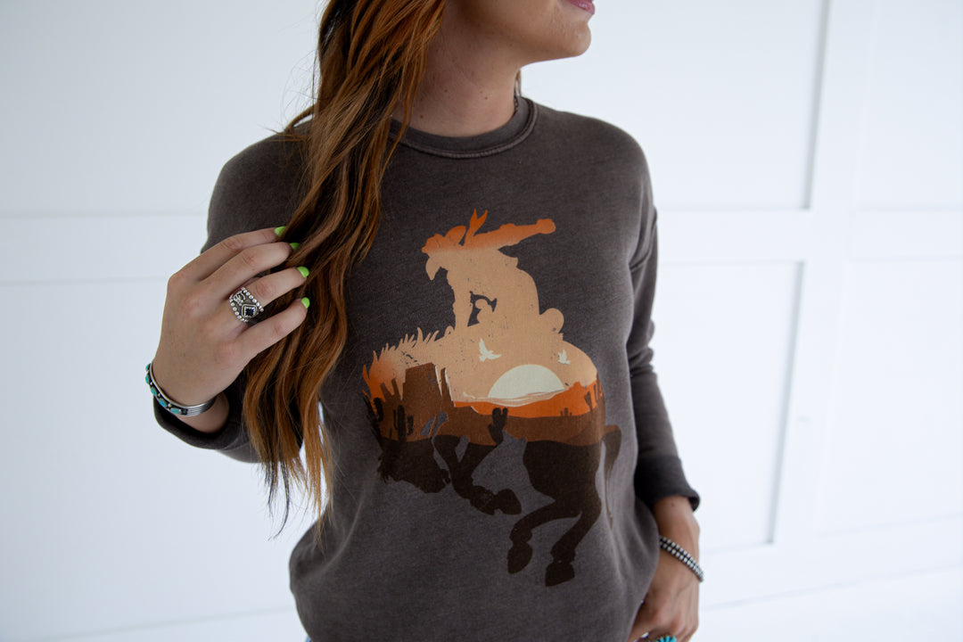 Show off your wild side with The Wild Cowboy Tee in a rich mineral brown. This comfortable and fashionable tee is available in sizes Small (3-5), Medium (6-8), Large (9-11), and X-Large (12-14). Ideal for any casual occasion, it’s a must-have addition to your wardrobe.