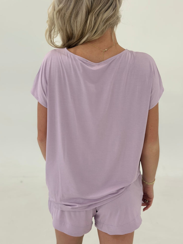 This lilac Loup Top blends effortless style with performance fabric. Featuring a classic boat neckline, dropped shoulders, and a relaxed silhouette, it’s made from high-quality viscose modal that stretches, breathes, and wicks moisture. The super silky texture and weightless feel make it a go-to for casual days or layering looks.