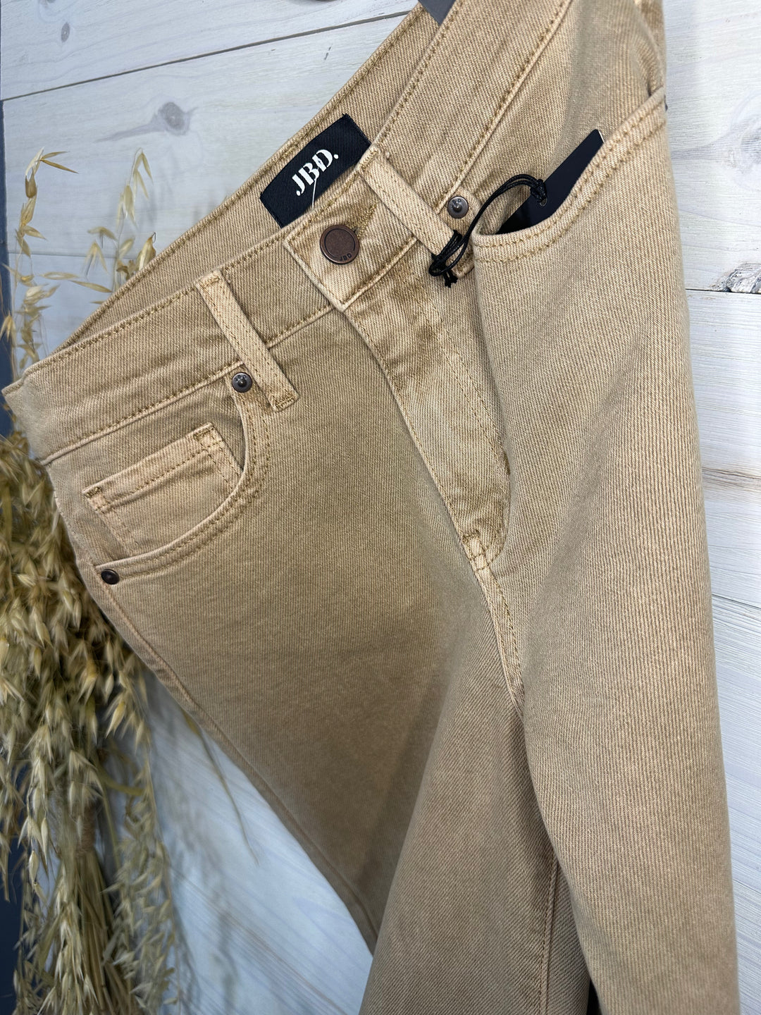 Elevate your wardrobe with the Woodstock High Rise Wide-Leg Jeans in Dark Khaki. Featuring a trendy cuffed hem, palazzo-style wide-leg cut, and high-rise fit, these jeans are made for modern fashion lovers. Crafted with a durable cotton blend, they provide structure without stretch. Ideal for versatile styling.